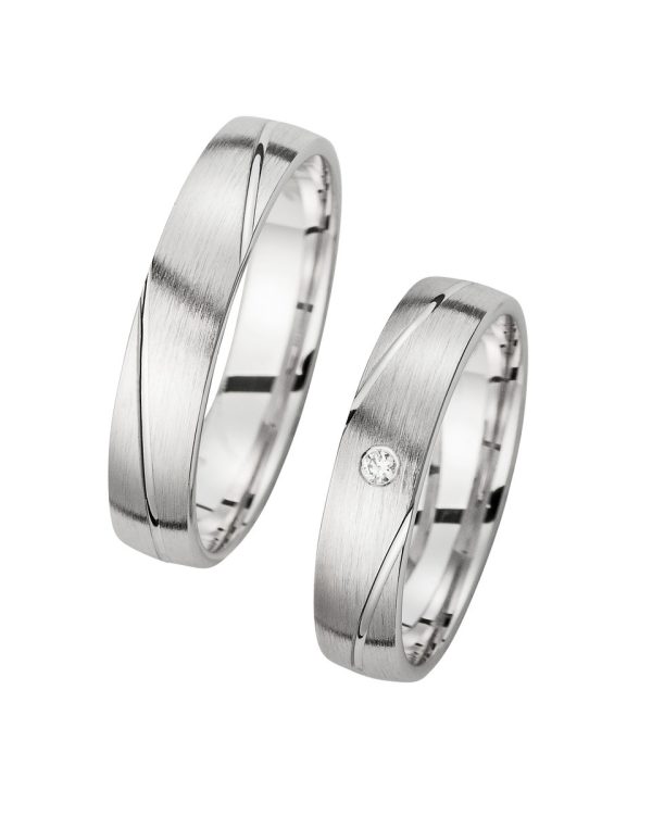 Elegante Trauringe aus Weißgold mit moderner Linienführung und Diamantbesatz