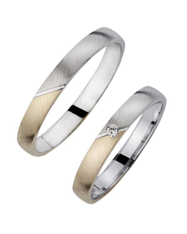 Elegante Trauringe aus Weißgold und Gelbgold mit schräger Mattierung und funkelndem Brillanten im Damenring